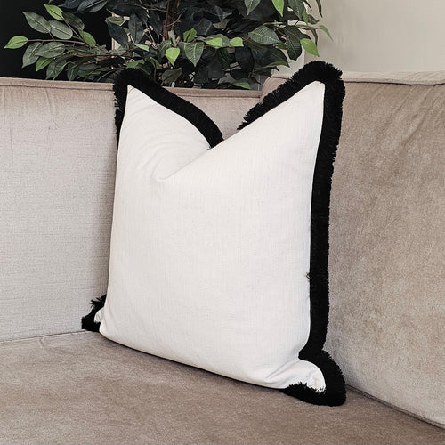 Conran- natural /contrasting luxury black ruche brush fringed cushion