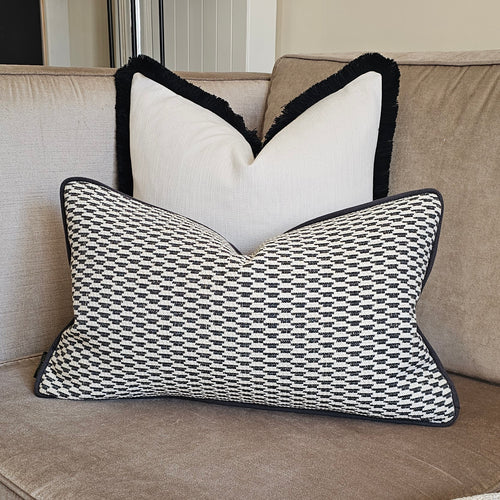 Logan/ Luxury black/ neutral textured cushion with contrasting piping