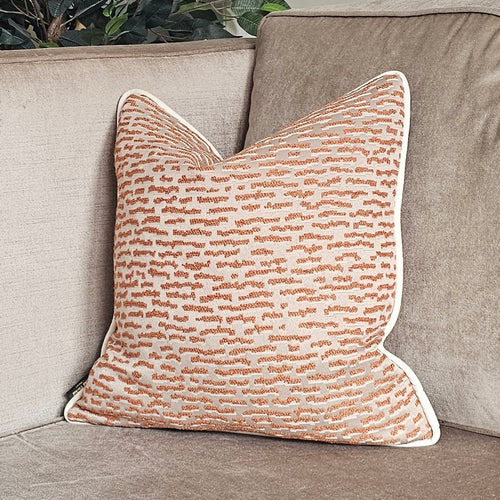 Ammolite / Rust Luxury neutral textured cushion with ivory velvet piping