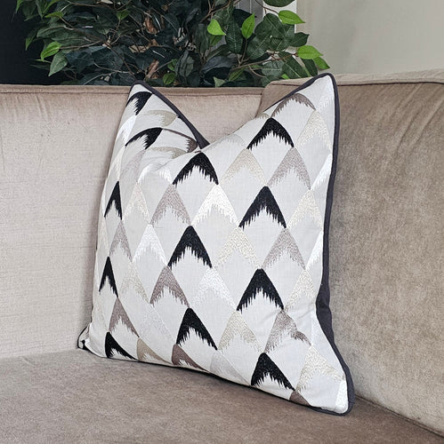 Aspen- Luxury embroidered cushion in black/ grey & neutral with contrasting piping
