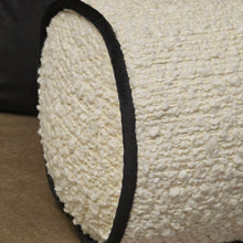 Load image into Gallery viewer, Cream boucle textured bolster cushion with contrasting black piping