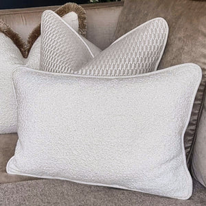 Oban/ cream boucle cushion with contrasting piping